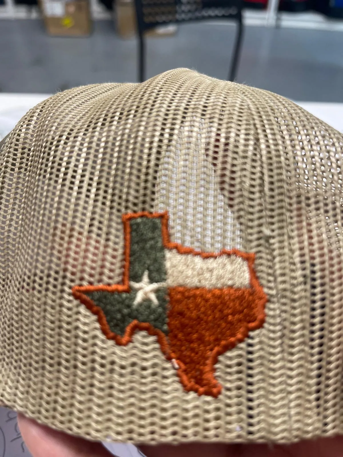 Embroidered Texas outline on a mesh trucker cap